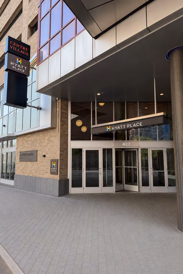 Hyatt Place entrance under a broad covered drive in downtown Minneapolis.